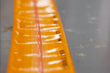 Resin-saturated CIPP pipe liner with TPU coating and center seam laid flat before trenchless pipe lining installation
