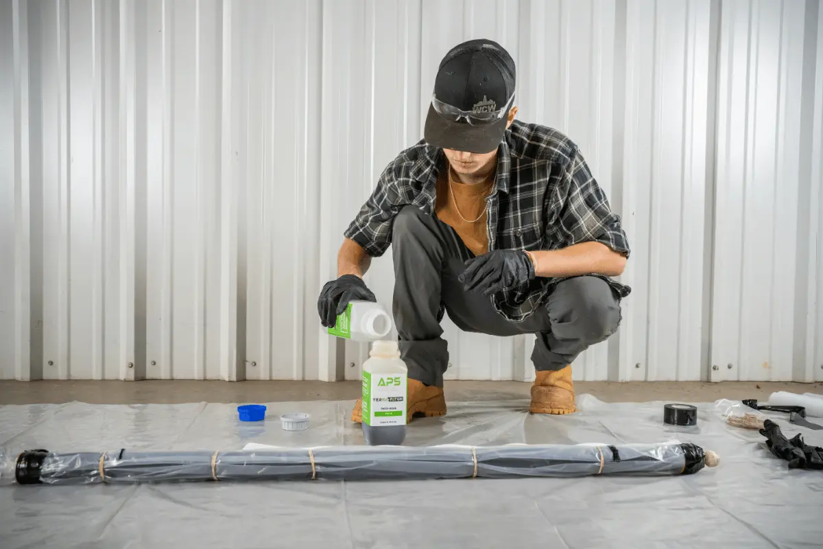 APS technician mixing Versa-Patch resin while preparing a trenchless pipe point repair system for CIPP pipe rehabilitation.