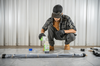 APS technician mixing Versa-Patch resin while preparing a trenchless pipe point repair system for CIPP pipe rehabilitation.