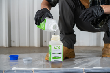 Contractor preparing Versa Patch resin for trenchless pipe patching using a professional pipe patch kit to repair a leaking underground pipe.