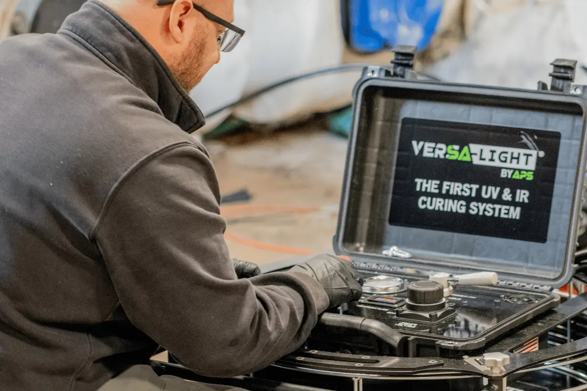 Technician operating the Versa-Light UV curing system by APS used for UV liner sewer trenchless pipe repair