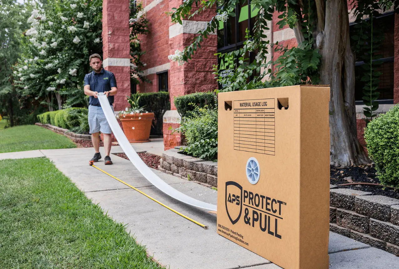 man pulling liner out of the protect & pull box