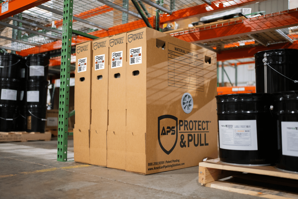 APS Protect & Pull CIPP liner storage boxes organized in a warehouse for protected storage and handling of trenchless pipe lining materials.