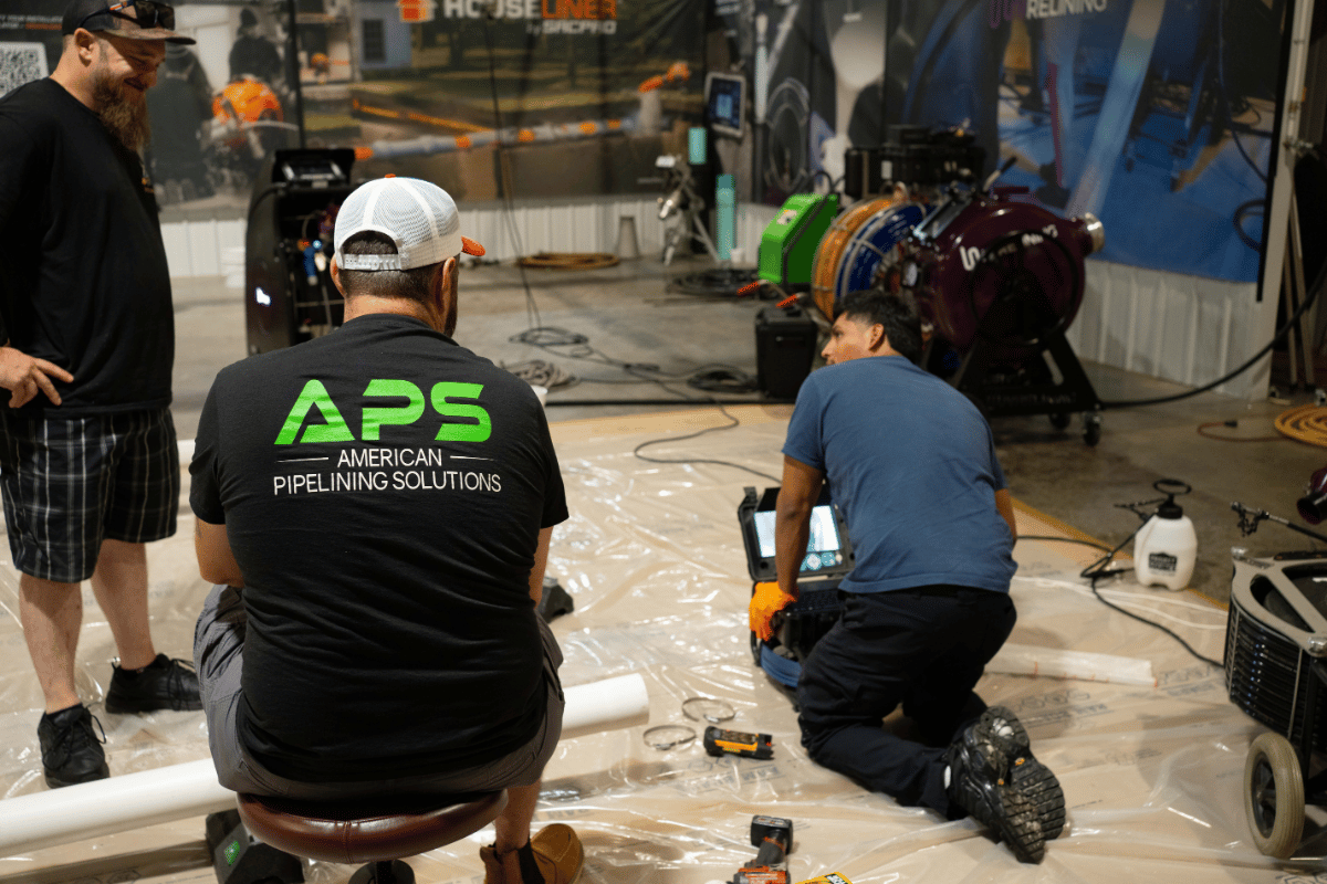 APS team providing hands-on trenchless training with pipe inspection camera equipment during an APSTA training session.